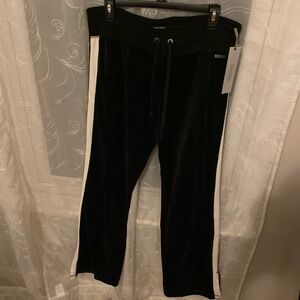 Calvin Klein velvet pants with white strip down the side